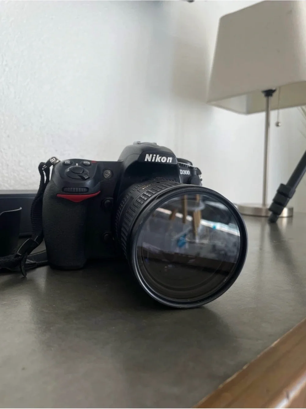 Nikon Black DSLR with Telephoto Zoom and Lens Hood
